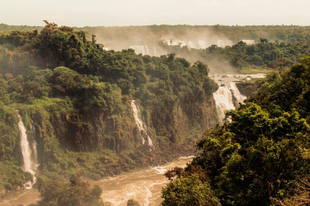 Majestic view of Iguazu Falls set in lush Brazilian rainforest.